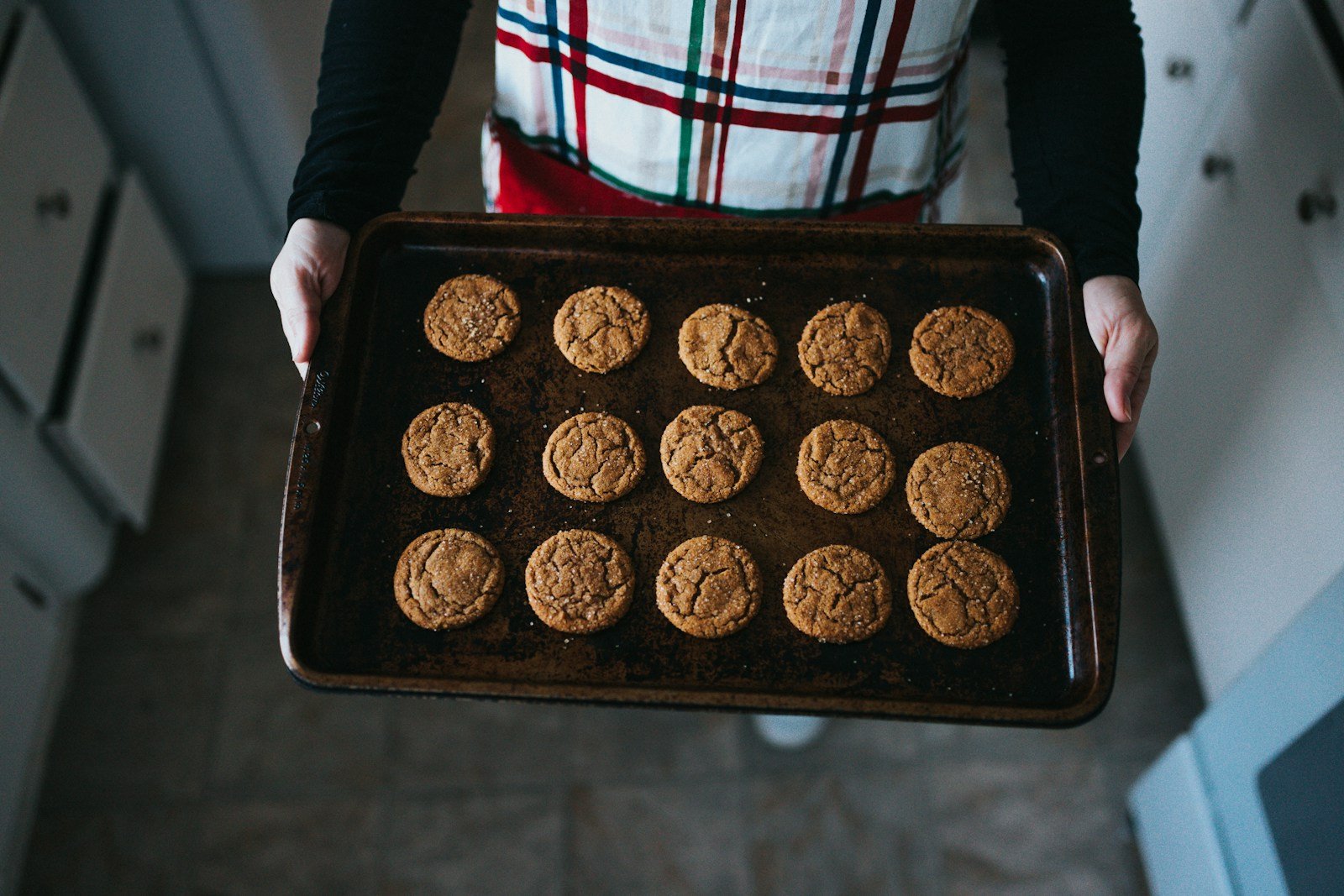 Photo by Nathan Dumlao person holding tray of cookies